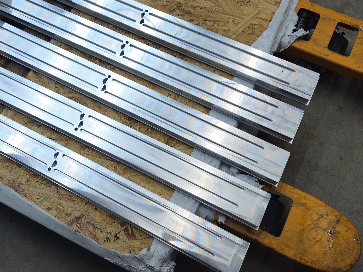 A lot of 38 inch machined tooling fixtures on a pallet